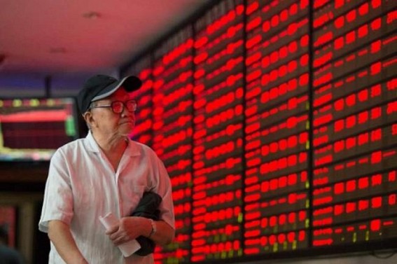 Chinese shares open higher; yuan weakens