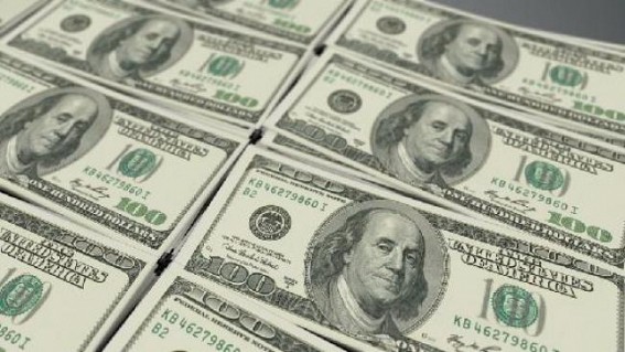 Dollar ticks up amid rise in bond yields