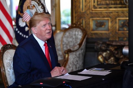 Trump criticised after sharing tweet naming whistleblower