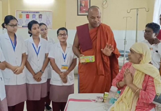 Buddhist monks distributed food among Cancer Patients ; prayed in hospital