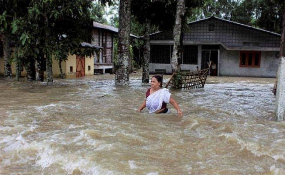 Flood, landslides hit neighboring Assam; 13,000 affected