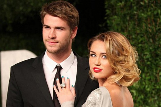 Cyrus, Hemsworth now married, had planned to first wed in Malibu before wildire