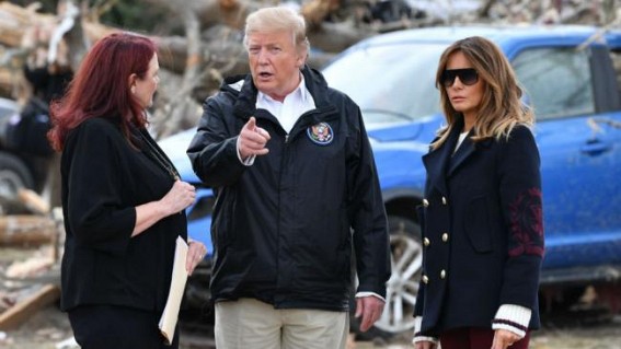 Trump signs Bibles during Alabama disaster visit