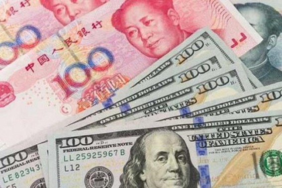 China's yuan edges higher against US dollar
