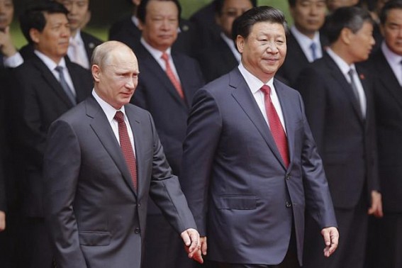 Xi, Putin hail 70th year of diplomatic ties