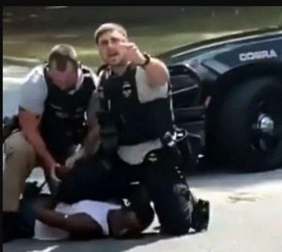 US cop fired for 'pinning, punching' black man