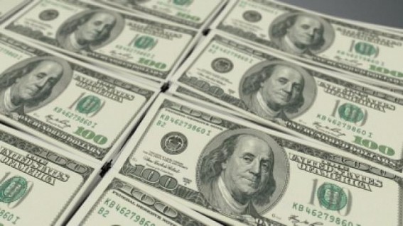 US dollar slips as traders focus on stimulus