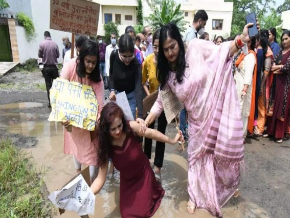 Bhopal women hold catwalk on potholed road to draw govt's attention