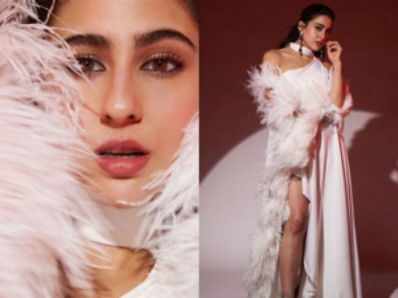 Sara Ali Khan dazzles in white thigh-high slit gown with feather sleeves, dewy makeup