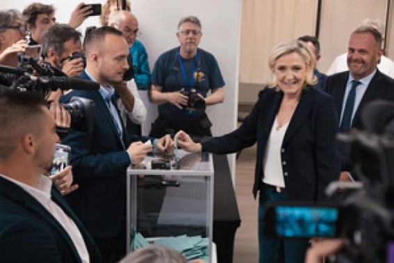 French parliamentary polls close with high turnout, exit poll indicates far-right tops vote share
