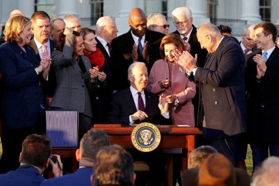Biden signs infrastructure bill into law after delay Biden signs infrastructure bill into law after delay